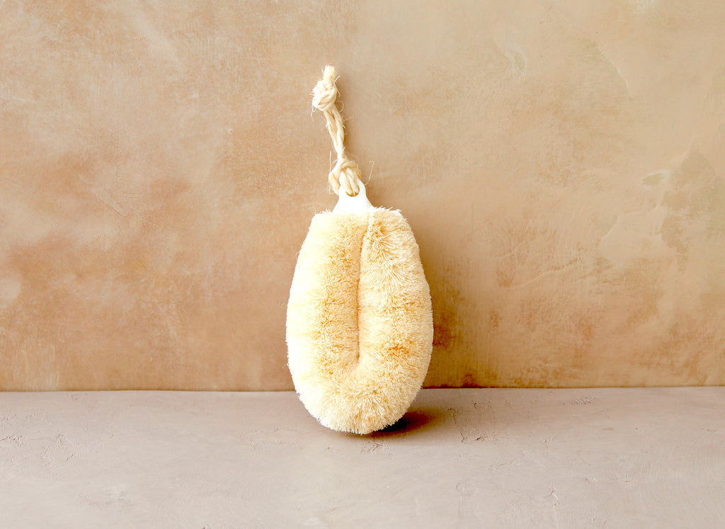 Pamper yourself with this luxury bath brush from BELLOCQ Tea Atelier. The Yashinoki Tawashi Body Brush is a soft bristled exfoliator made to fit comfortably in your hand and sway breezily on your bath shelf.