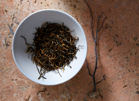 No. 99, Jin Jun Mei is a most sought-after fully-oxidized (black) tea from the Wuyi Mountains of Fujian Province of fine, delicate leaves complete with fuzzy golden tips.